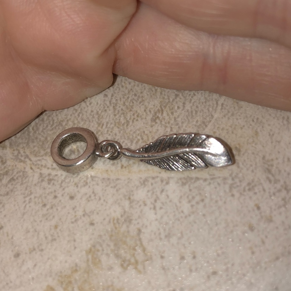 Feather charm